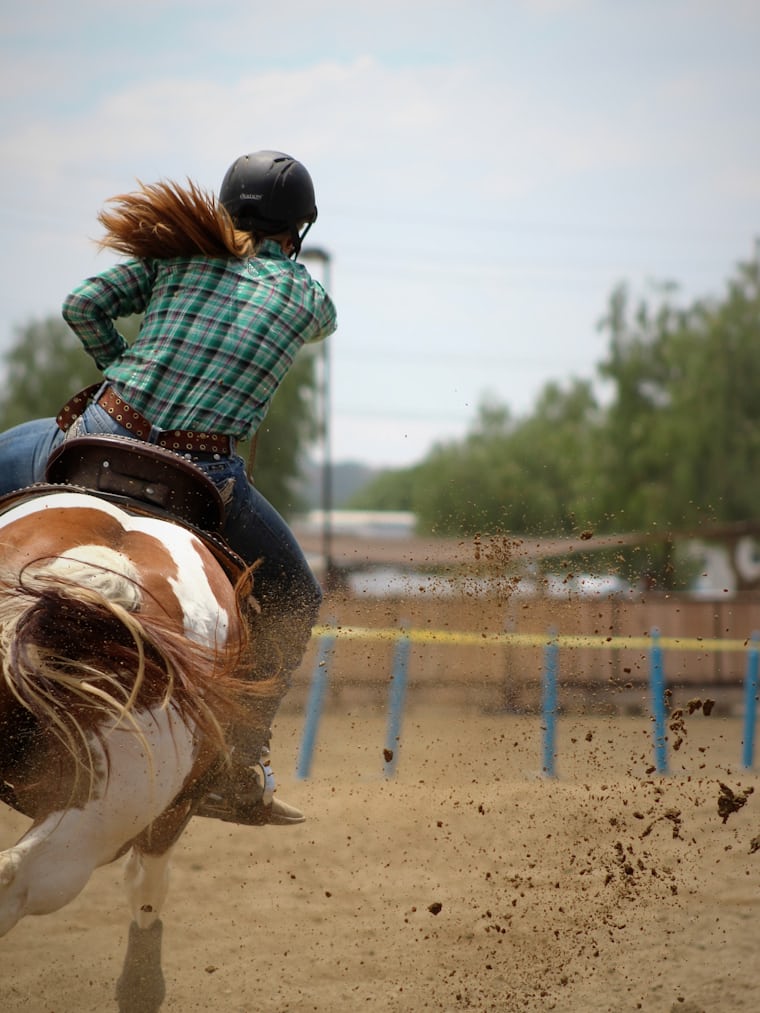 Rider during a canter lesson in the arena